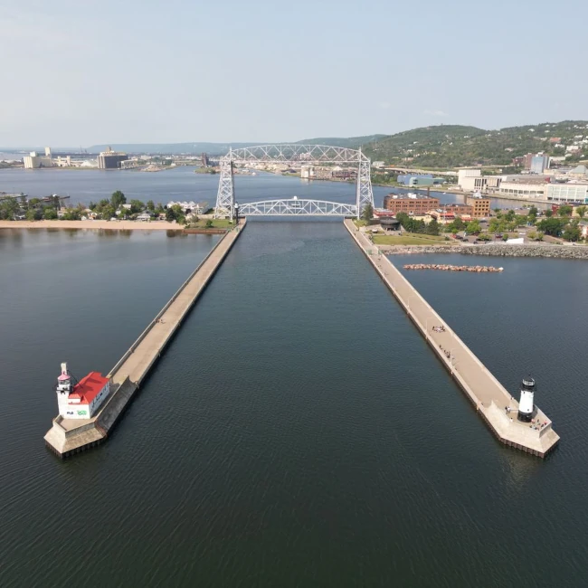 A stunning aerial shot of Duluth's iconic Aerial Lift Bridge and surrounding harbor on a clear day. Photo courtesy of Pexels user 'Giant Asparagus'